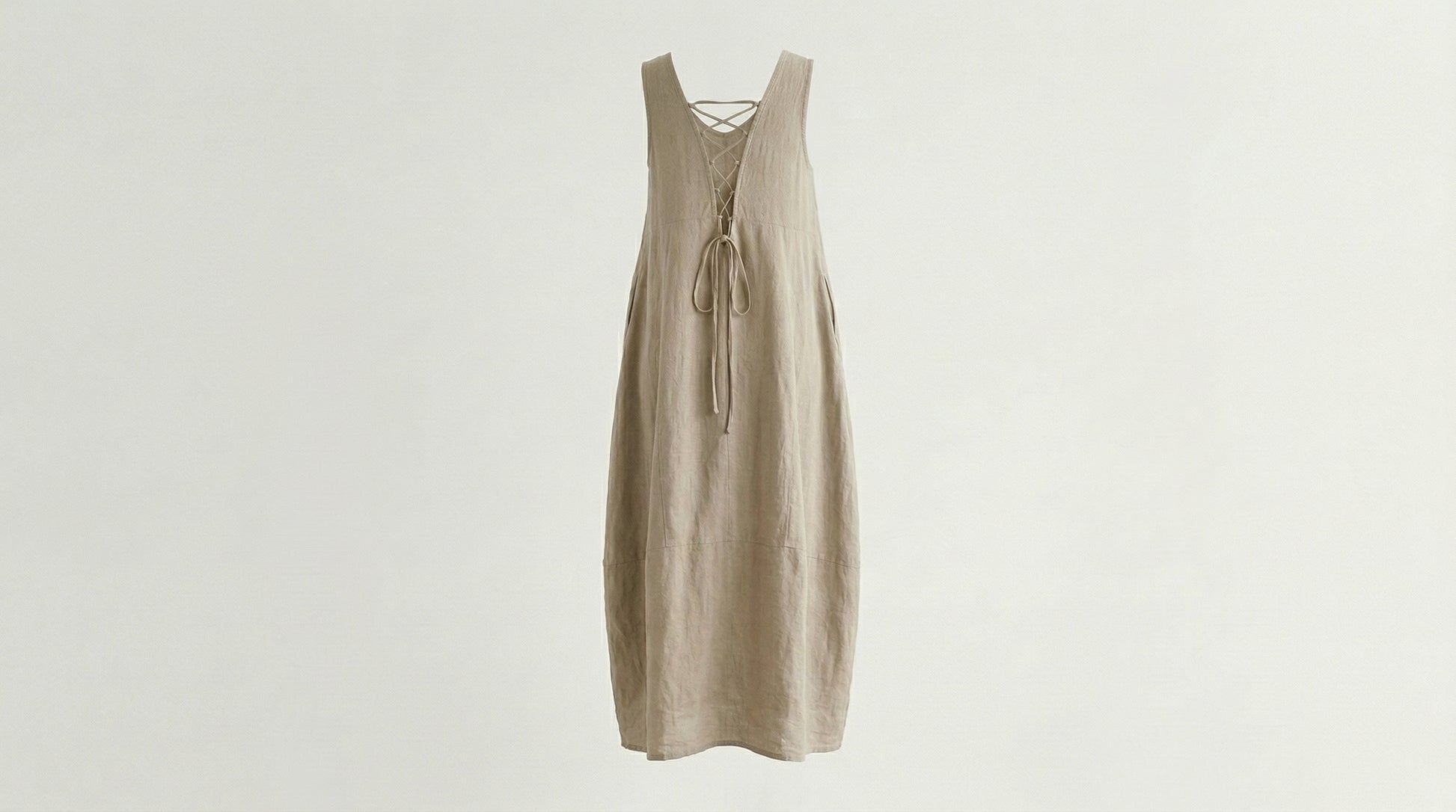 Beige dress on a light gray background