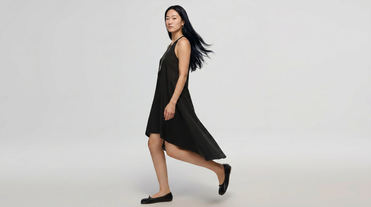 Woman wearing a black dress on a white background