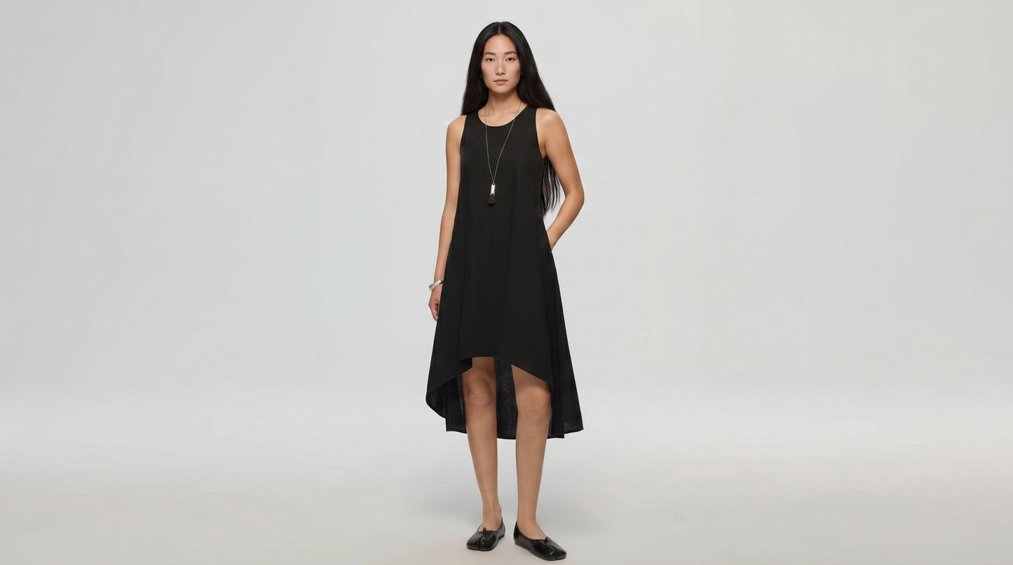 Woman wearing a black dress on a white background
